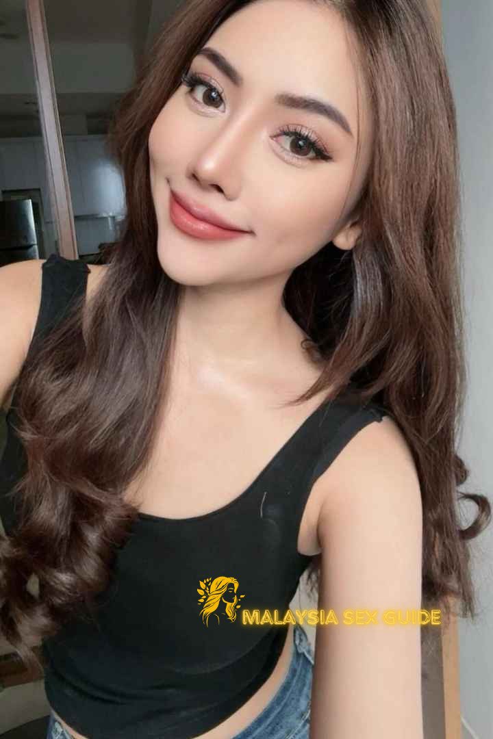 Attractive Malay woman in a black top. Malaysia Escort.