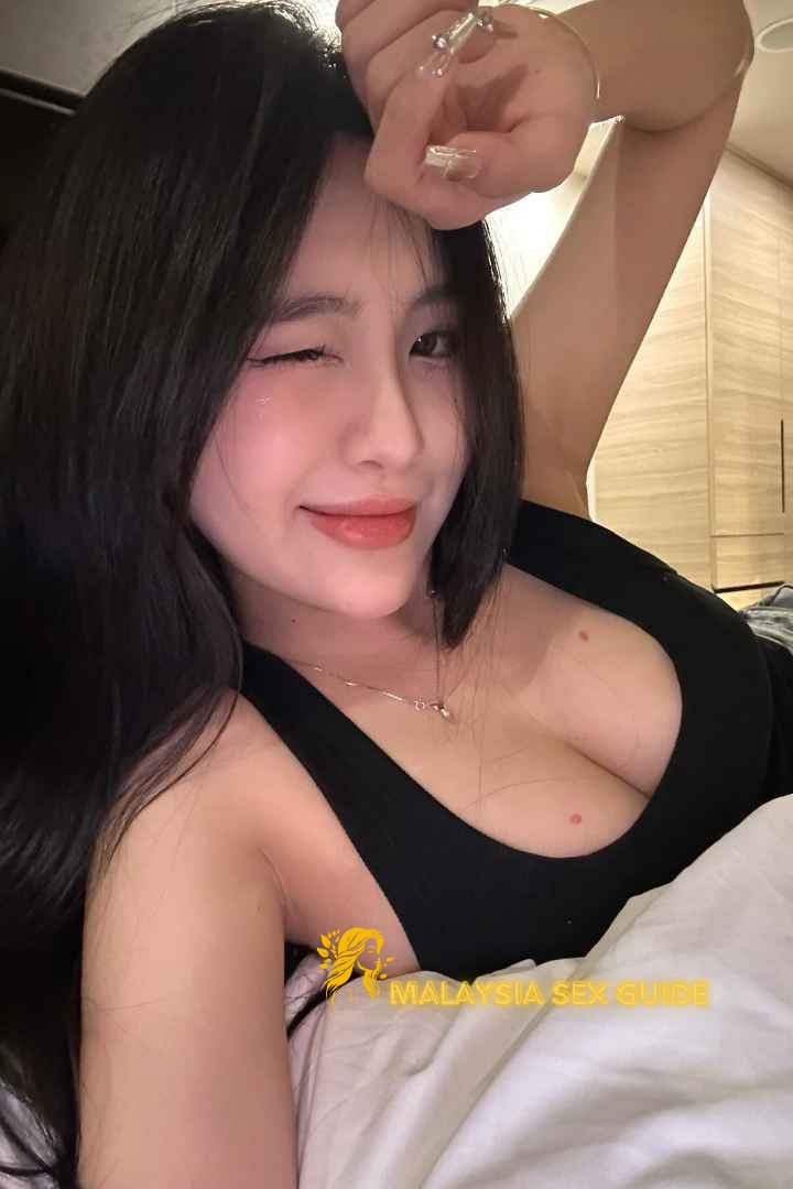Attractive young woman in a black top.