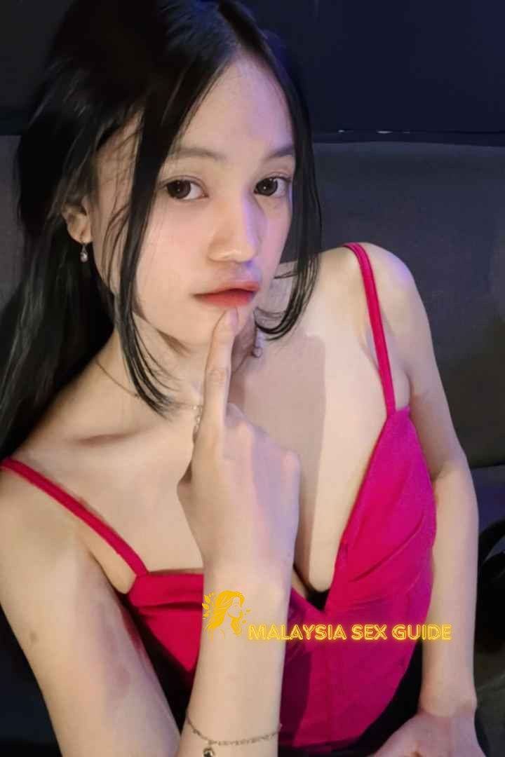 Attractive young woman in a pink top.