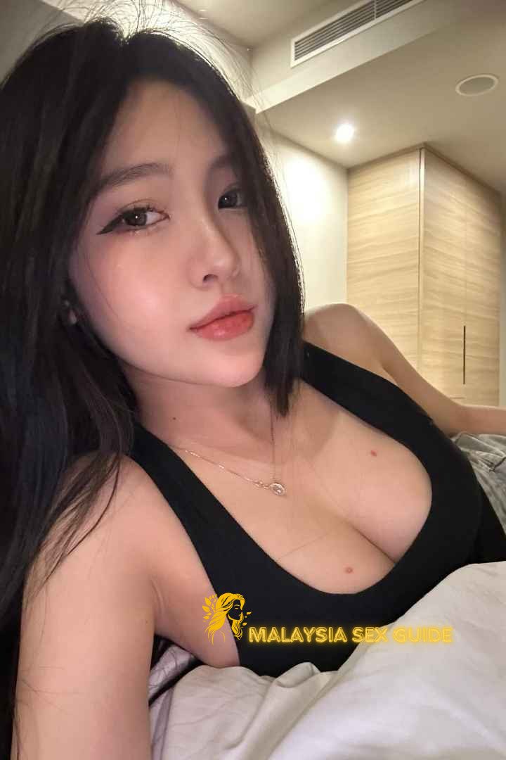 Attractive young woman in a black top.