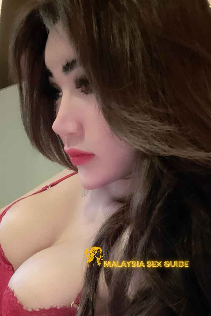 Attractive KL escort girl in red lingerie.